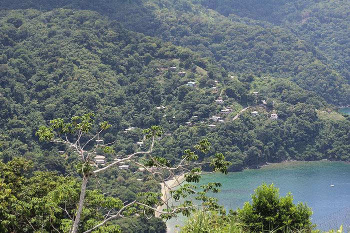 Winding coastal road through green hills