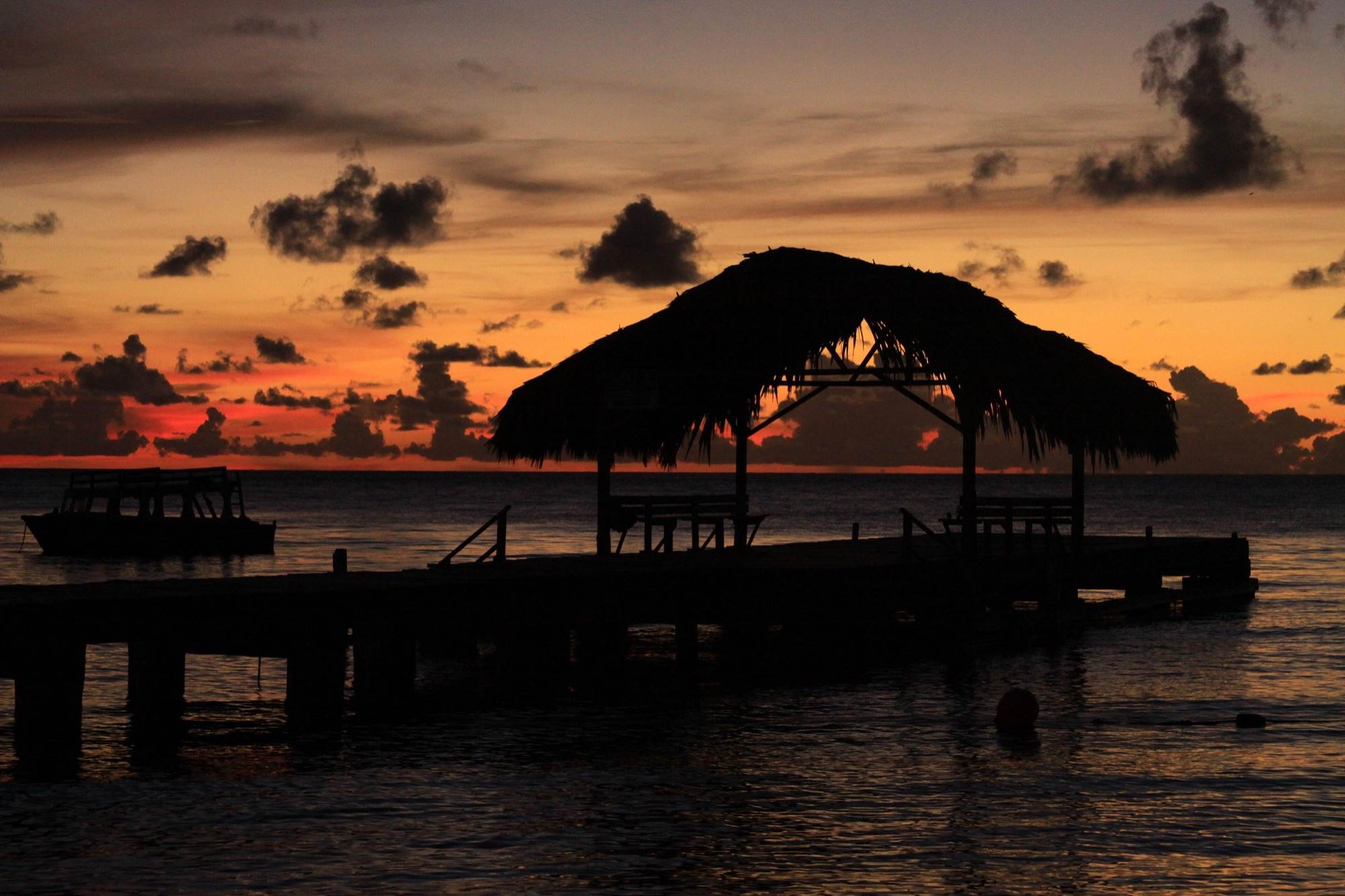 The Pigeon Point jetty silhouetted at sunset