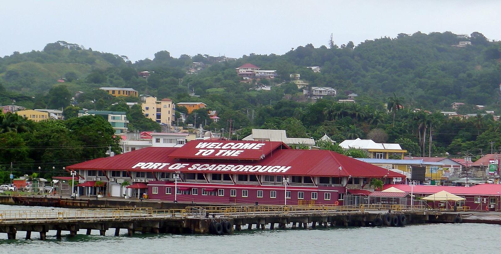 The red-roofed Welcome to the Port of Scarborough terminal seen from the water